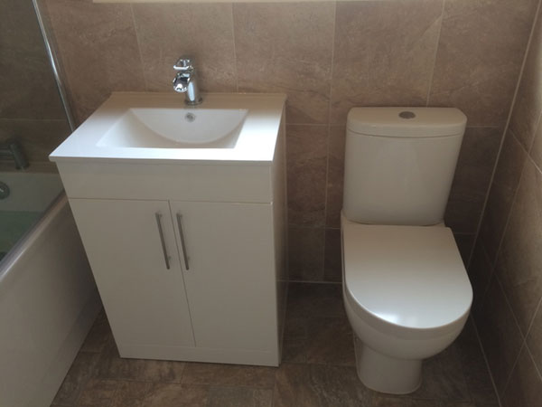After the vinyl flooring was laid, a basin vanity unit and close 