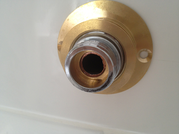 Push The Connector Over The Pipe With Bathroom Installation In Leeds