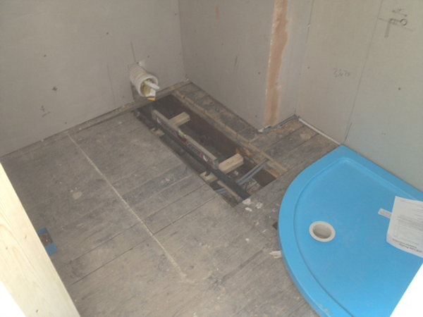 Running A Shower Waste In Between Floor Joists With Bathroom Installation In Leeds