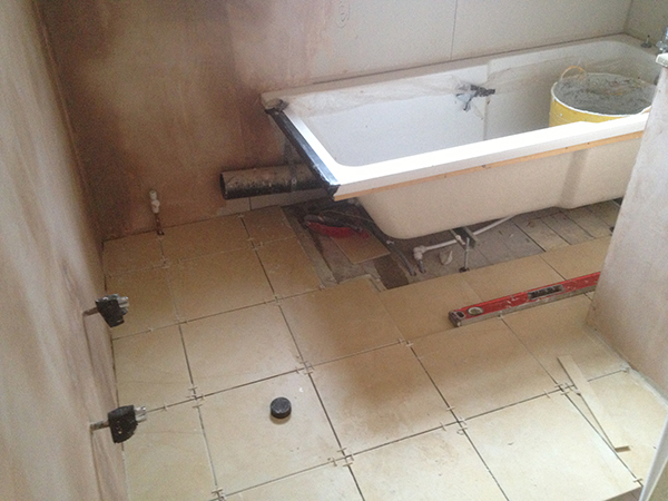Laying Out Floor Tiles With Bathroom Installation In Leeds