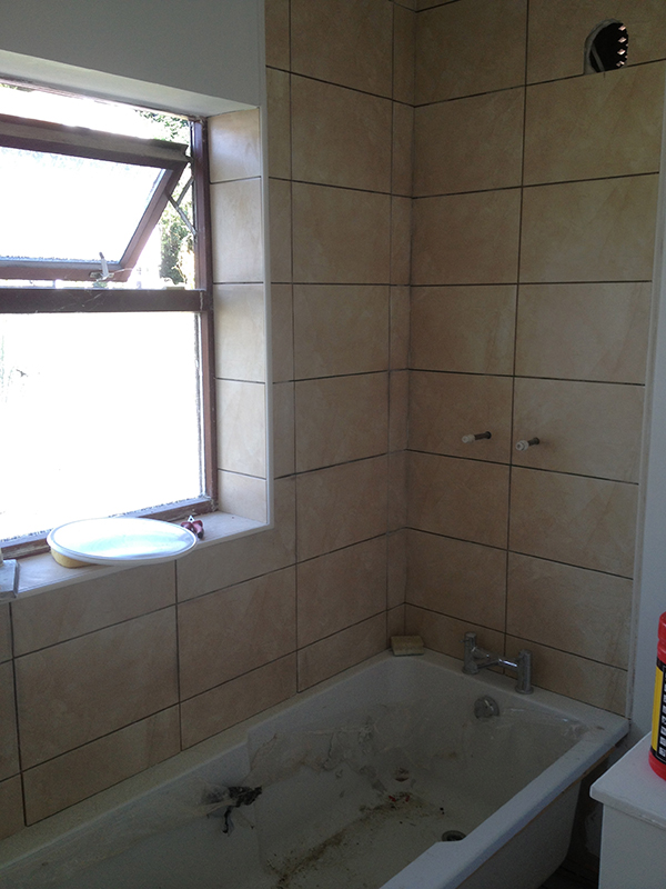 Tiling Around The Bath With Bathroom Installation In Leeds