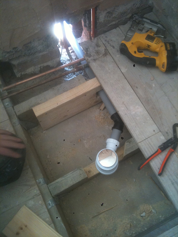 Reinforcing Joists Under A Shower Tray With Bathroom Installation In Leeds