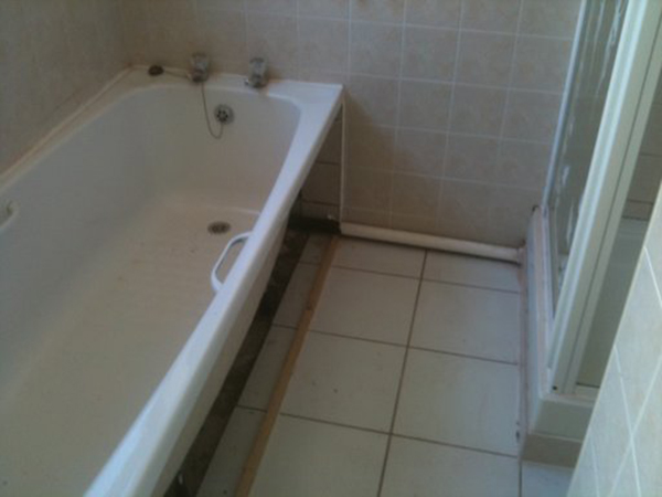 Floor Finish Does Not Extend Under Bath With Bathroom Installation In Leeds