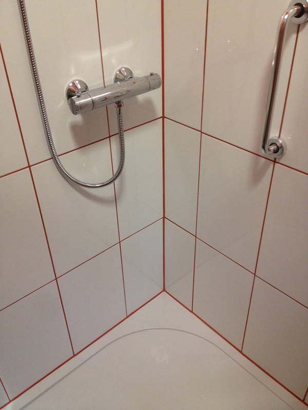 Red Silicone To Match Grout With Bathroom Installation In Leeds