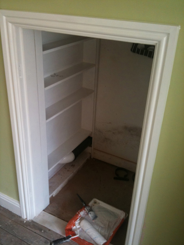Painted Shelving Under Stairs With Bathroom Installation In Leeds