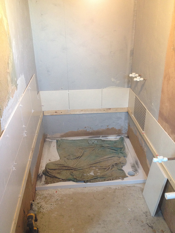 Getting The 1st Row Of Wall Tiling Level With Bathroom Installation In Leeds