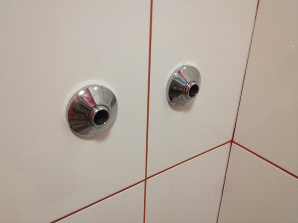 Attaching The Chrome Collars With Bathroom Installation In Leeds