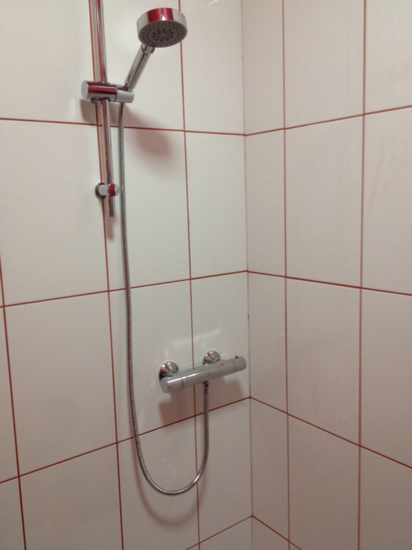 Attaching The Shower Riser, Hose And Shower Head With Bathroom Installation In Leeds