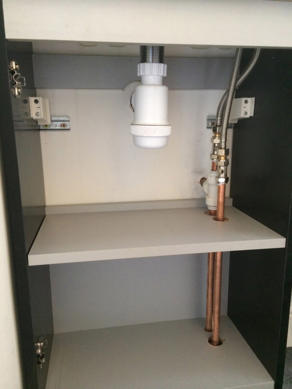Neat Pipework In Cabinet With Bathroom Installation In Leeds