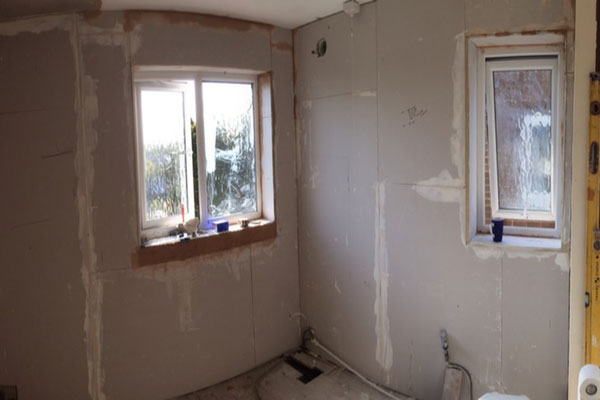 Walls Reboarded After Stripping Tiles And Blown Render With Bathroom Installation In Leeds