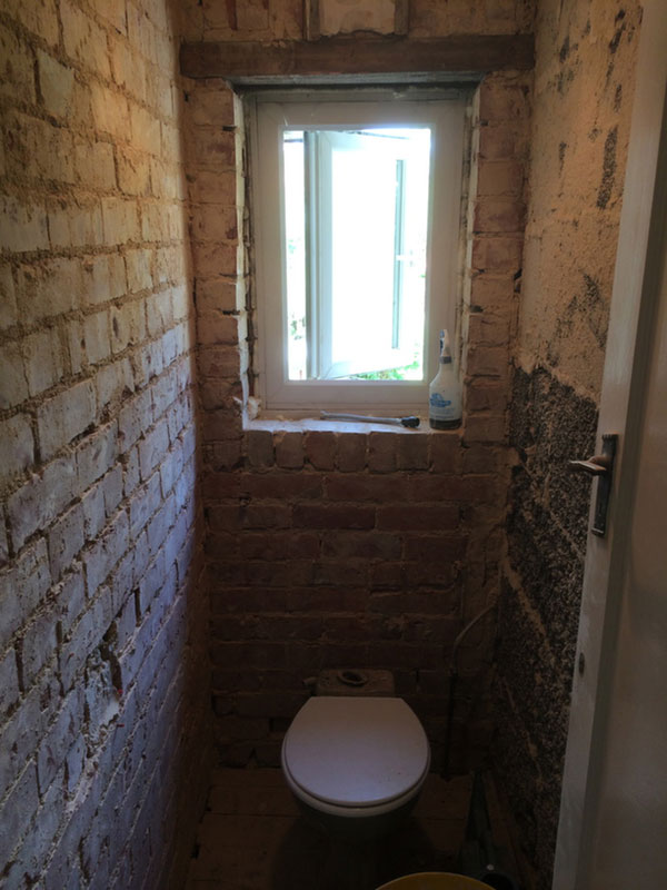 Toilet After Wall Tiles And Render Stripped With Bathroom Installation In Leeds
