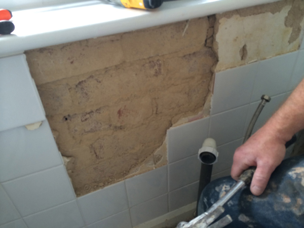 Blown Render Behind Tiles With Bathroom Installation In Leeds