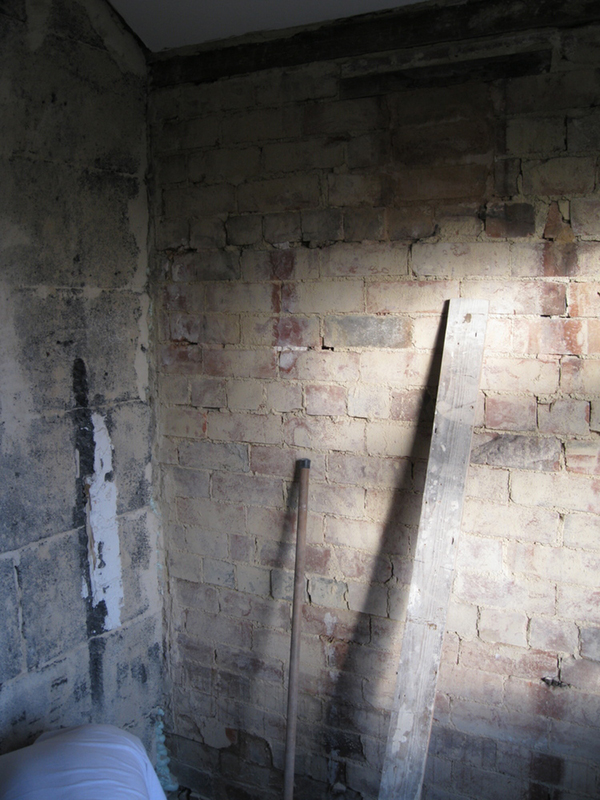 Old Tiles Removed And Render Blown Beneath With Bathroom Installation In Leeds