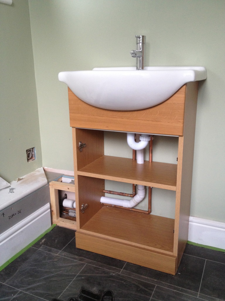 Basin installation with boxed in pipework