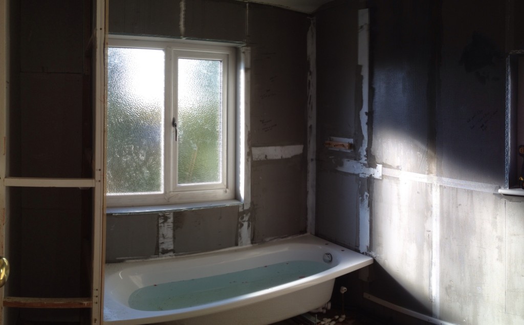 bath installation with reboarded walls