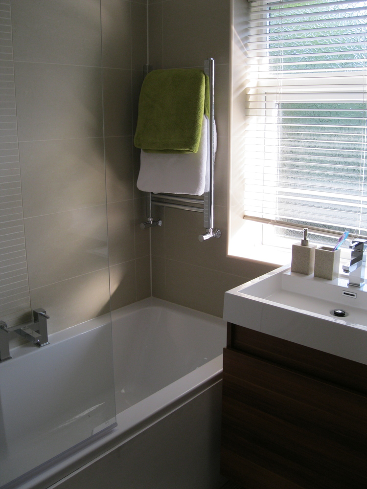 towel radiator over wall to wall bath