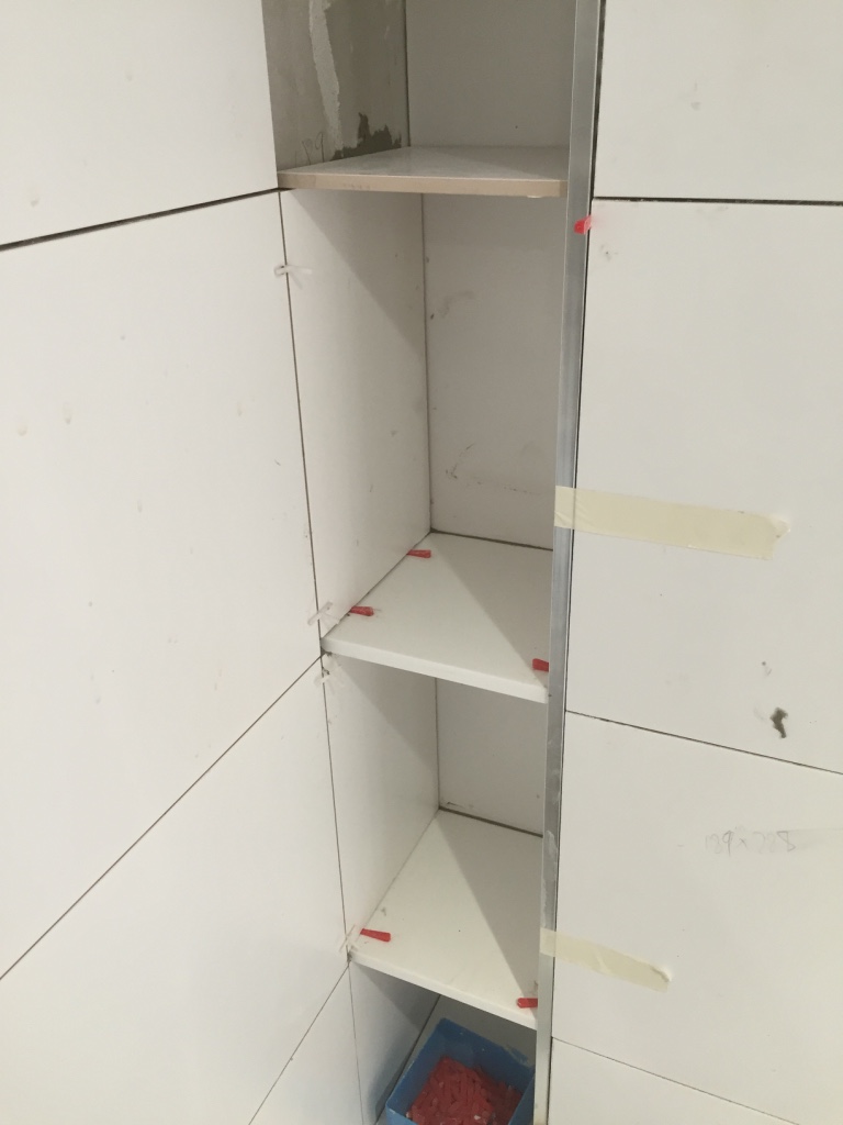 adding CORIAN shelves to bathroom alcove