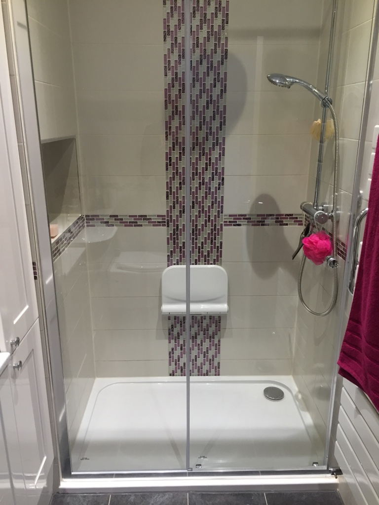completed master en suite shower with seat