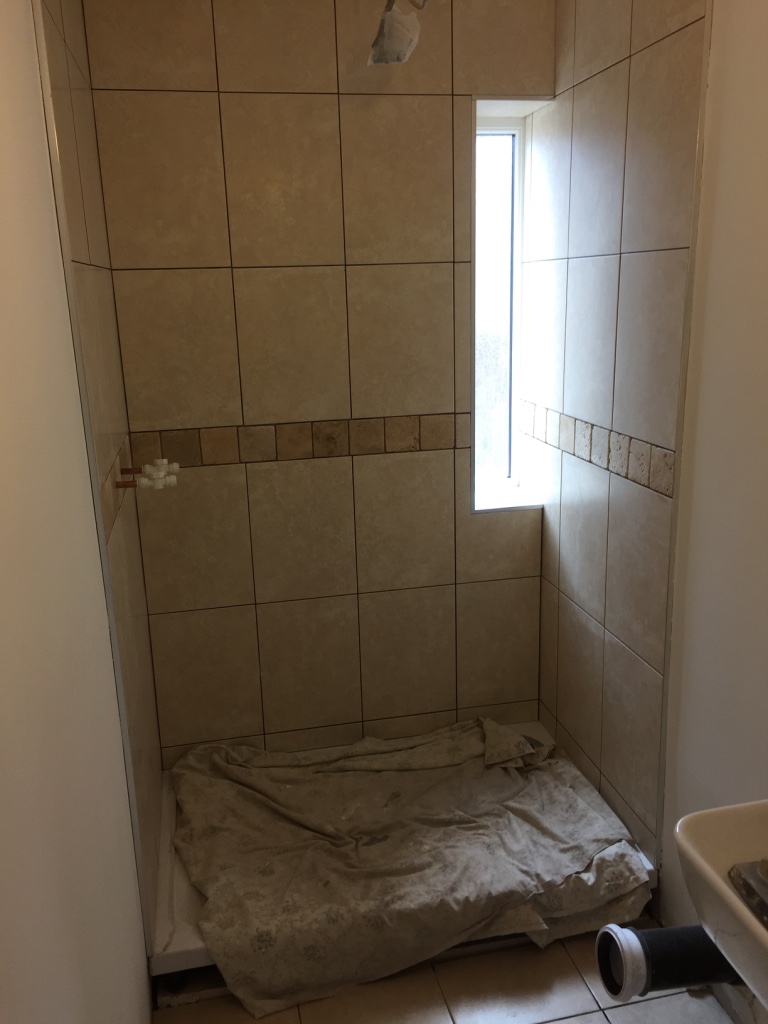 en suite shower enclosure with small window
