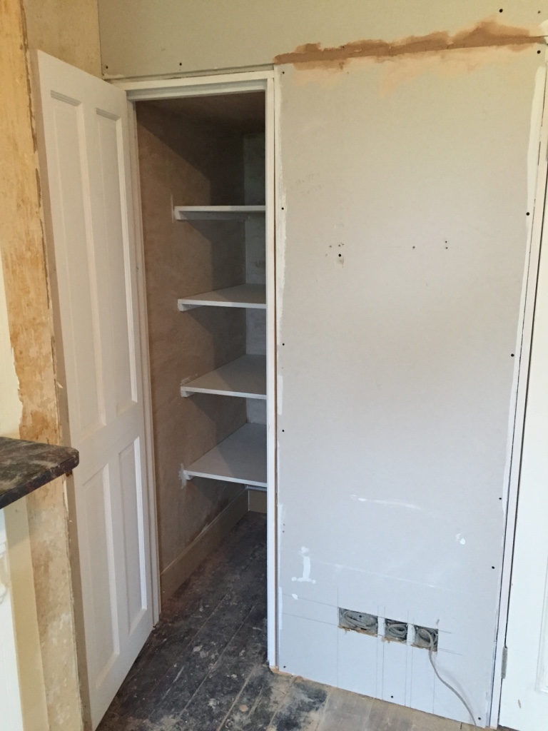 storage-cupboard-with-custom-shelves-fitted
